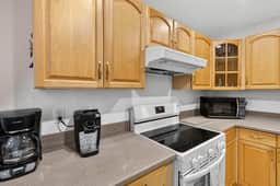 Updated 2-Bed Condo Steps from Beach